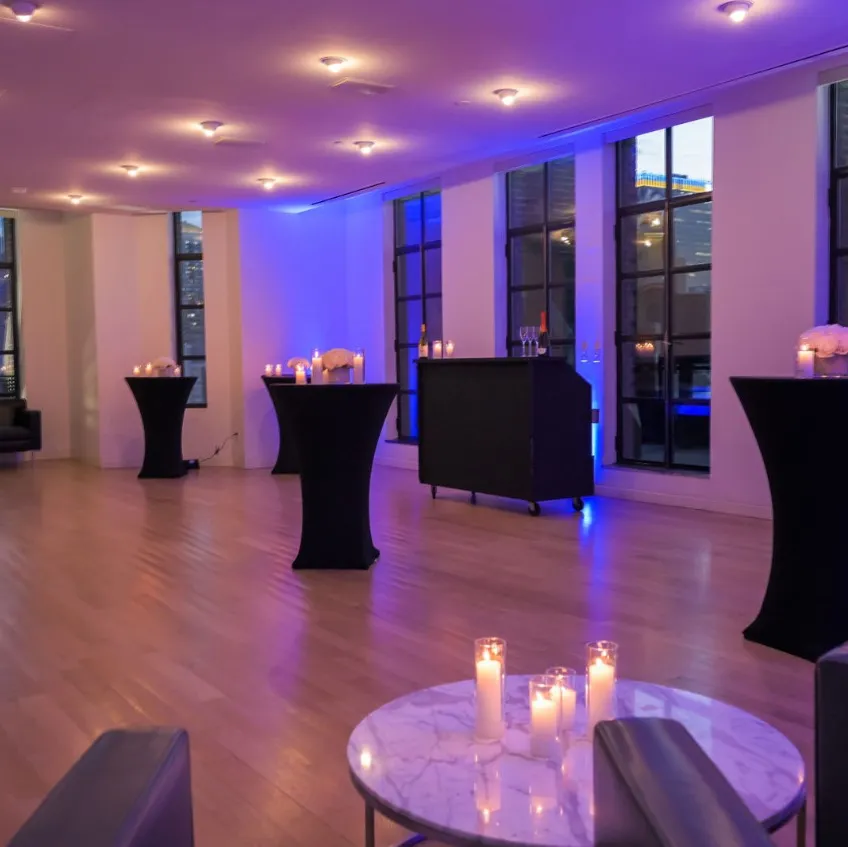 Conference Room set for a standing reception with purple lighting