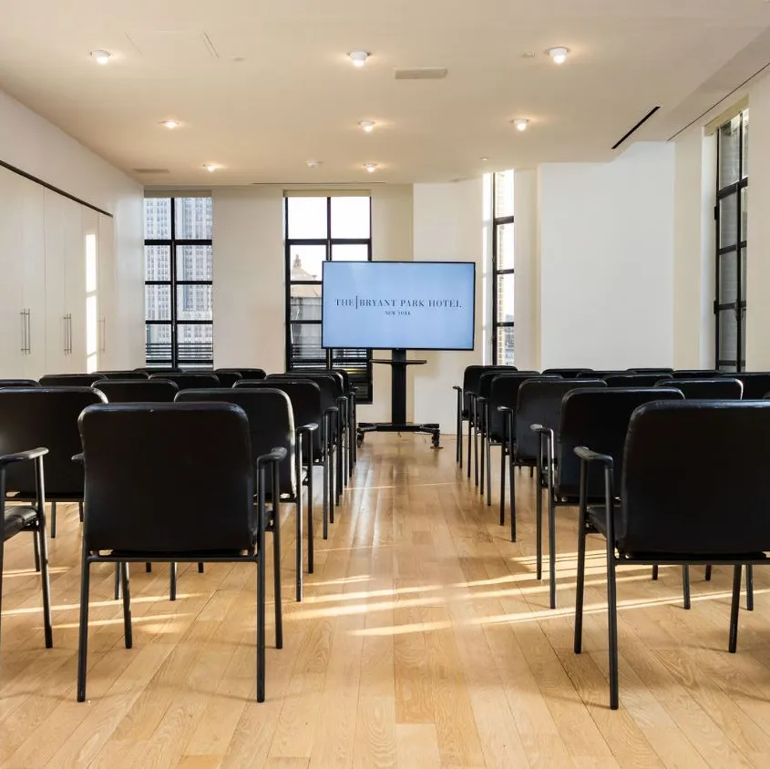 Conference Room set up classroom-style facing a screen